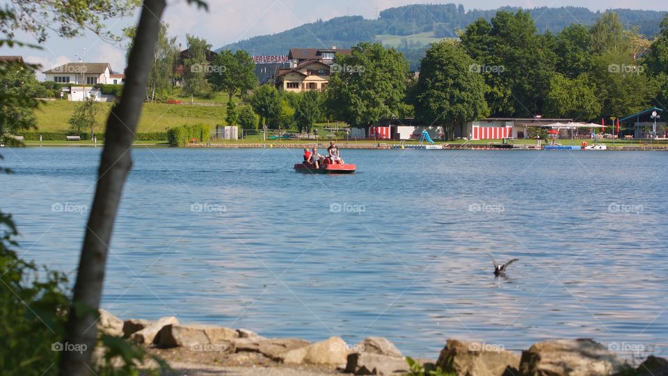 Young People Having Fun On Water Bike