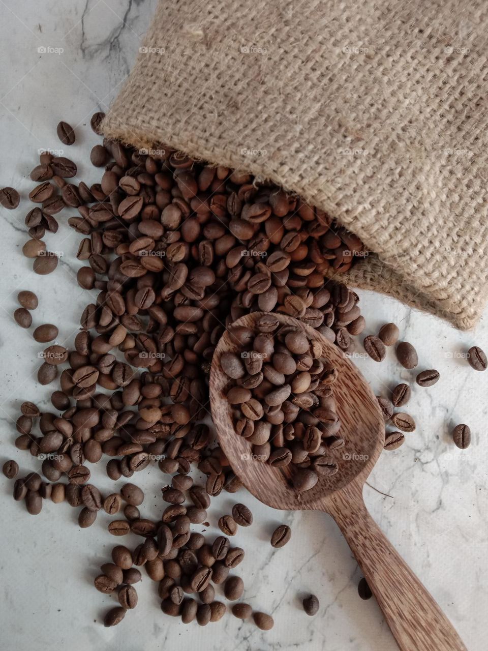 Coffee beans contain caffeine, carbohydrates, protein, magnesium, and plant chemicals such as polyphenols and diterpenes.