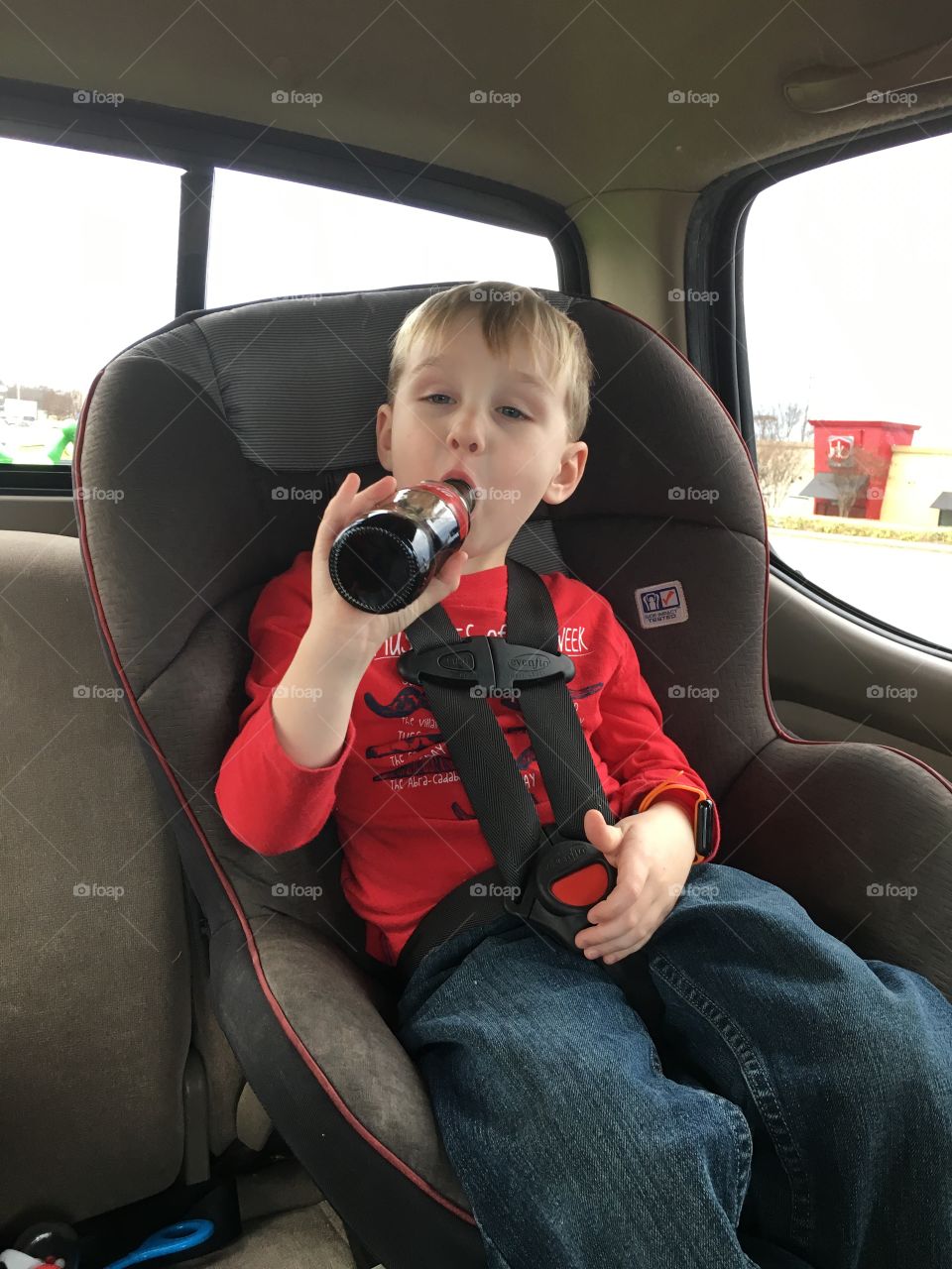 A toddler and a coke 