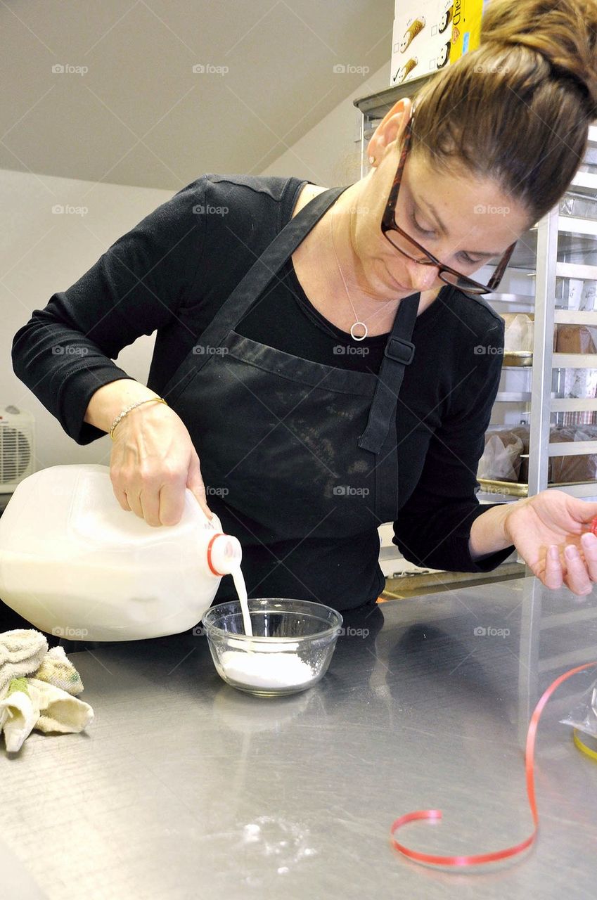 Pouring Milk to bake 