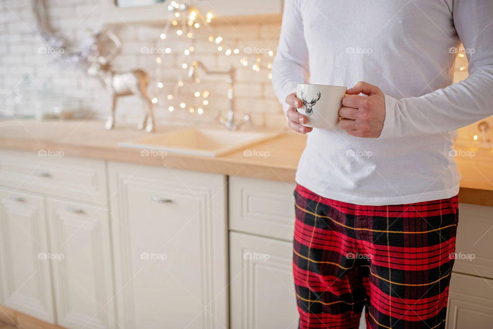 cup of coffee in a cozy festive Christmas atmosphere