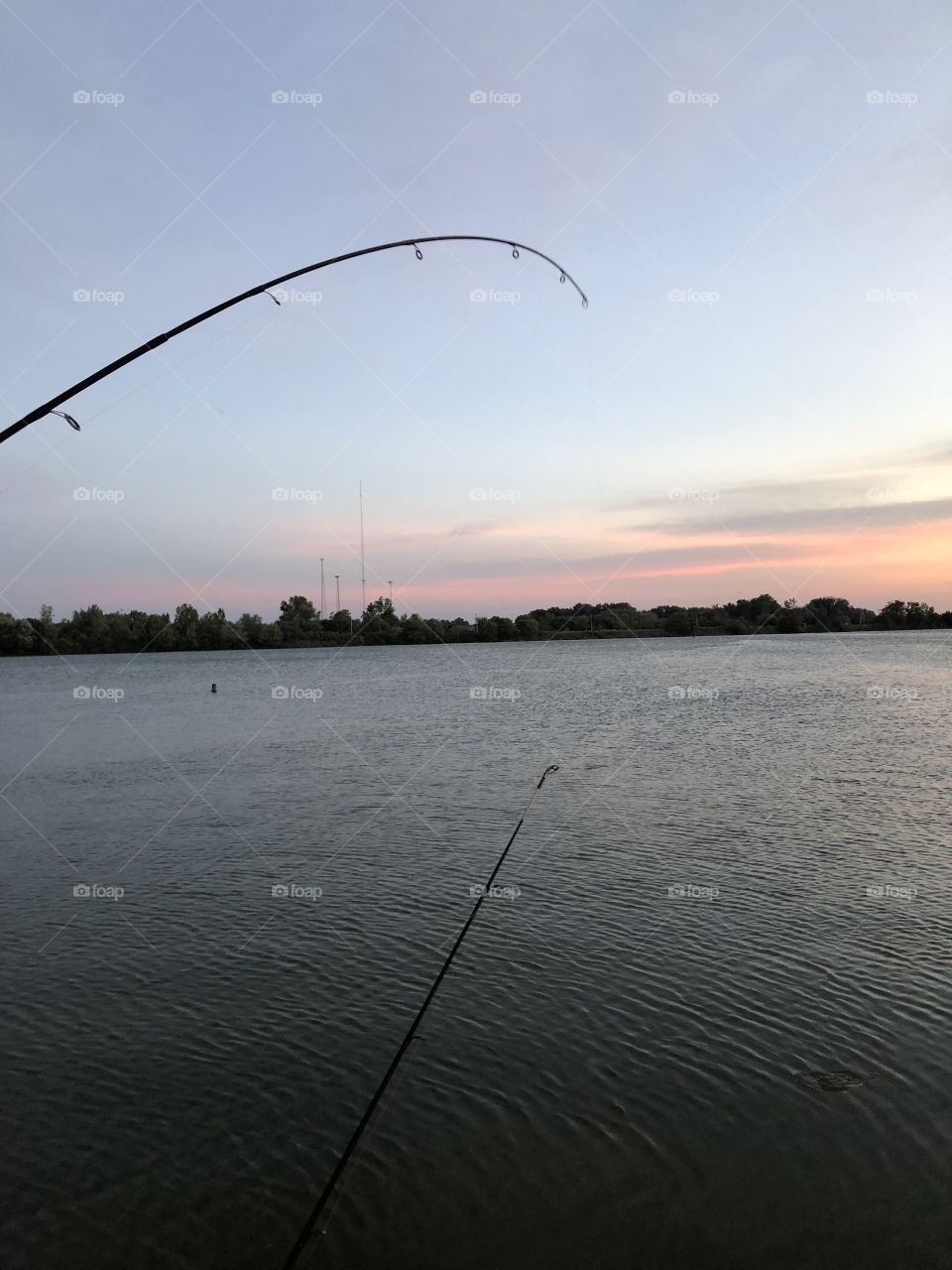 Fishing at sunset in action. 