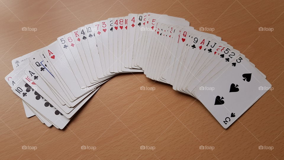Playing cards game on table