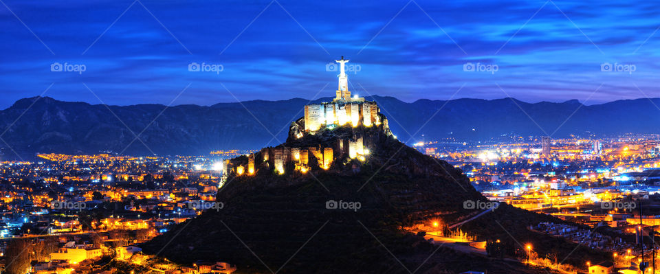 Monteagudo Christ statue and castle at night in Murcia, Spain