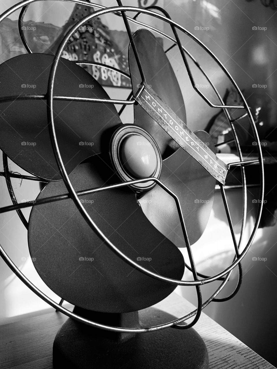 A vintage metal desktop fan, from Montgomery Ward. Practical, pleasing, sturdy, old school.