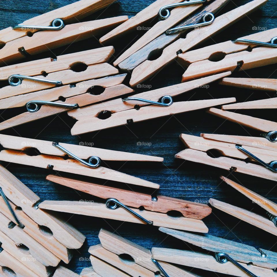Wooden clothespins on a wooden base
