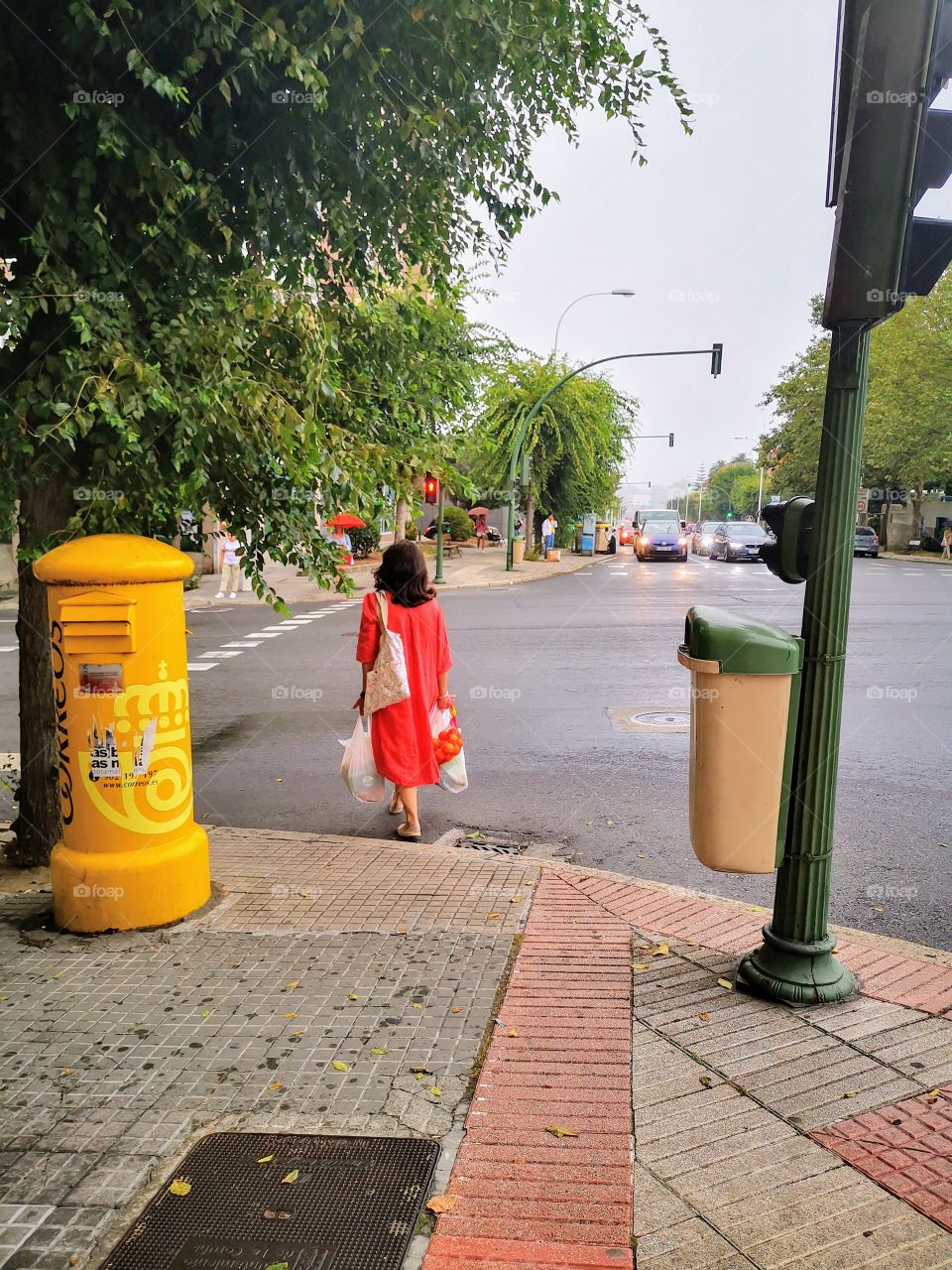 Red woman across the road