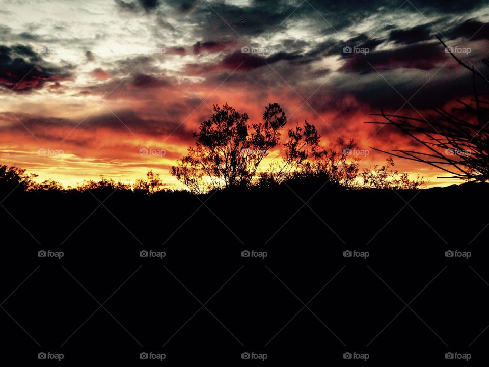 Blood Red Sky. Photo shot of the silhouetted desert landscape with the sunset behind it