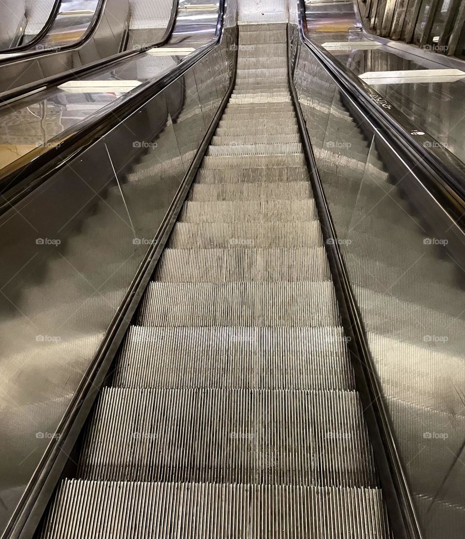 The escalators leading to the subway are actually sliding rectangles.