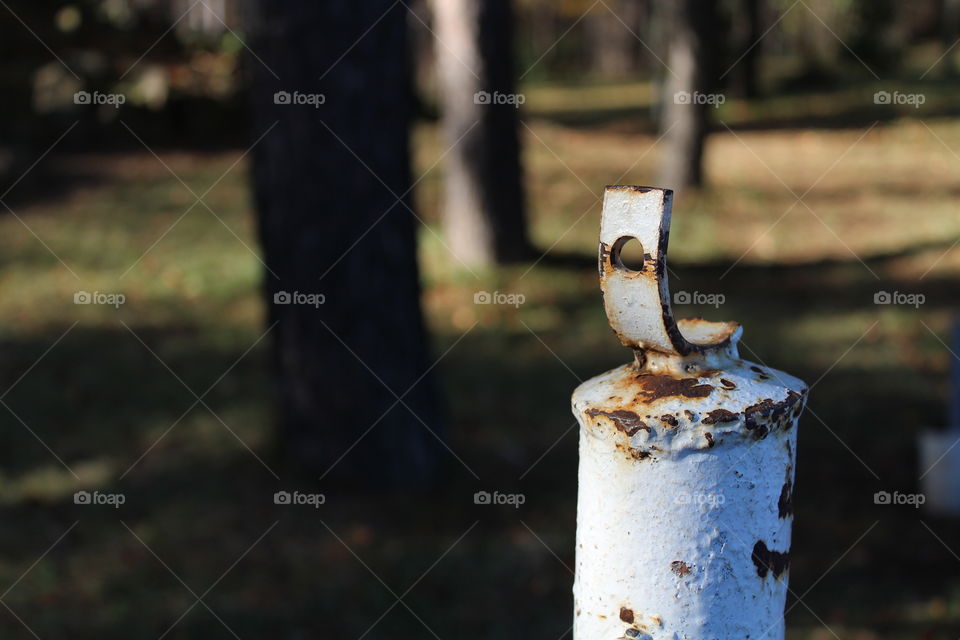 macro of an rusted old support metal poll