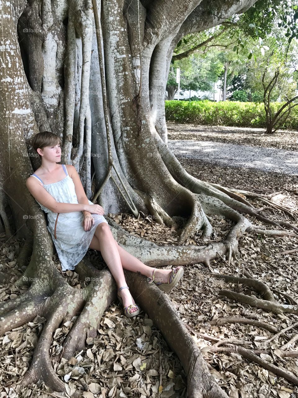 Sitting against a tree