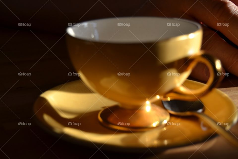 Golden tea cup