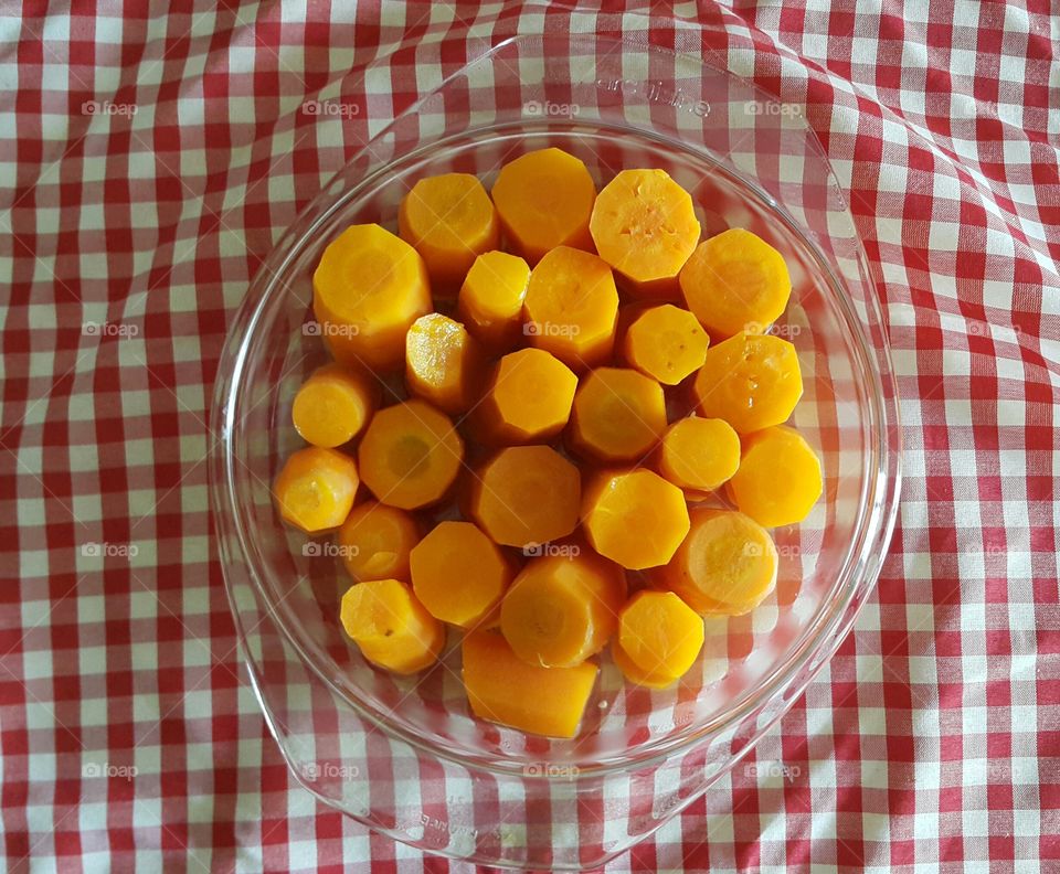 carrots jungle. carrots  cut in a plate on a checked background