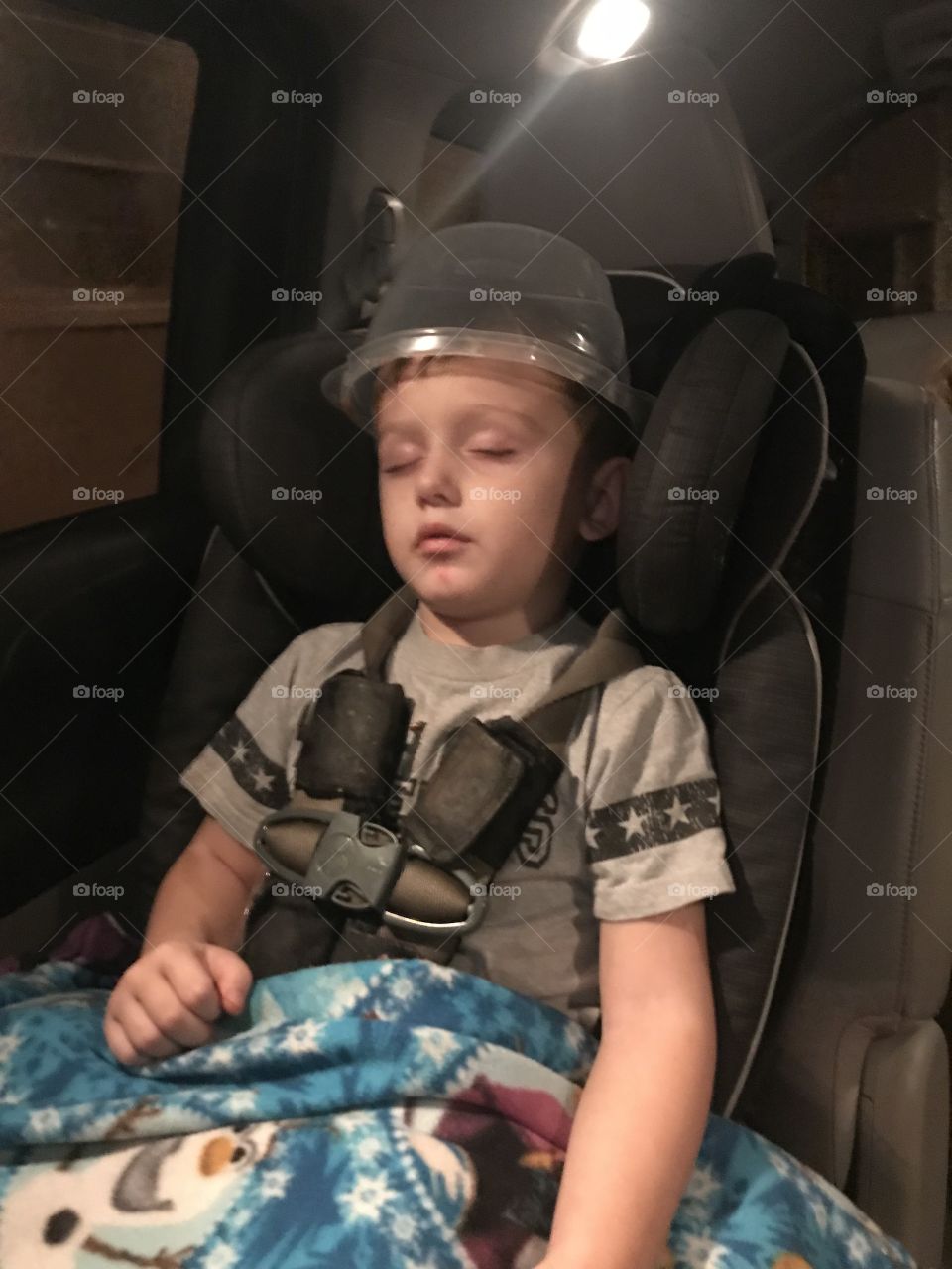 This little guy fell asleep in his carseat with a plastic bucket on his head. 