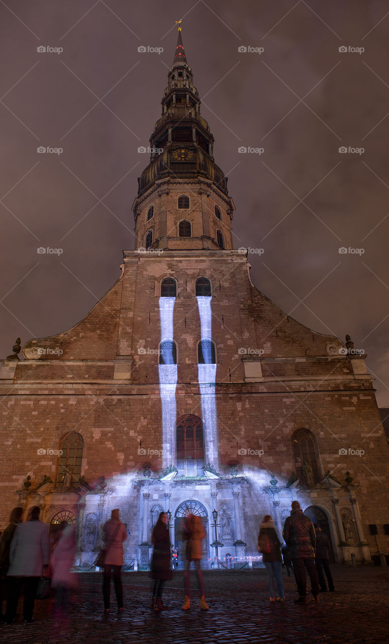 Light waterfall in the wall of an old church wall in city Riga, Latvia