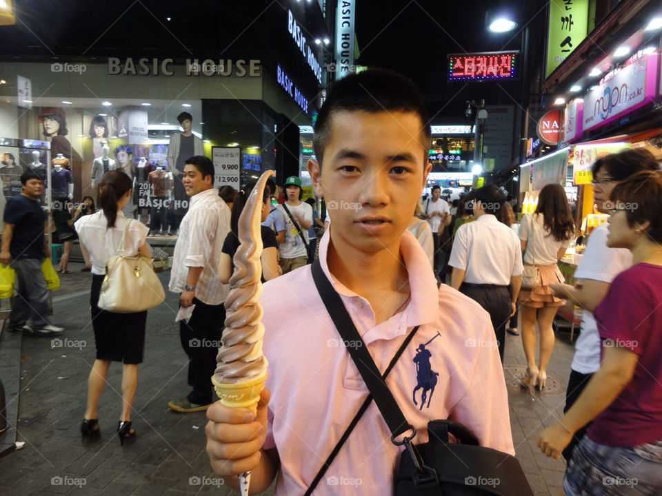 Me eating tall ice cream in South Korea..