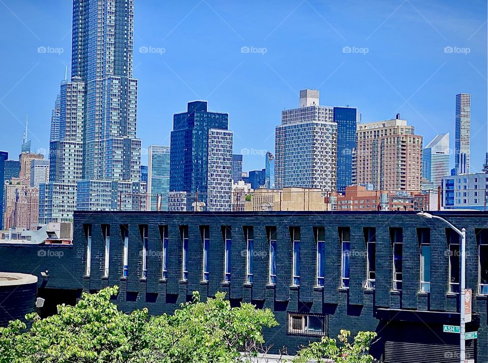 An even closer view of LIC, Queens as seen from the „Greenpoint“, Bklyn side of the „Pulaski Bridge“ at „Newtown Creek“ ascending the stairs to the pedestrian lane of the bridge. 2022. Hypnotic Productions