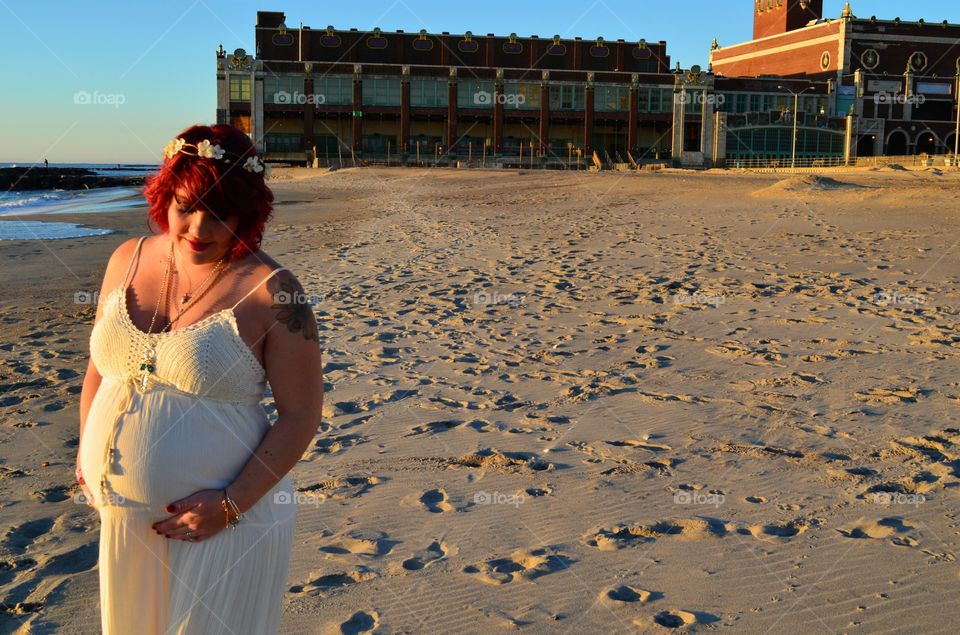 Glowing pregnancy. Mother-to-be glistening in the sunshine at Asbury Park