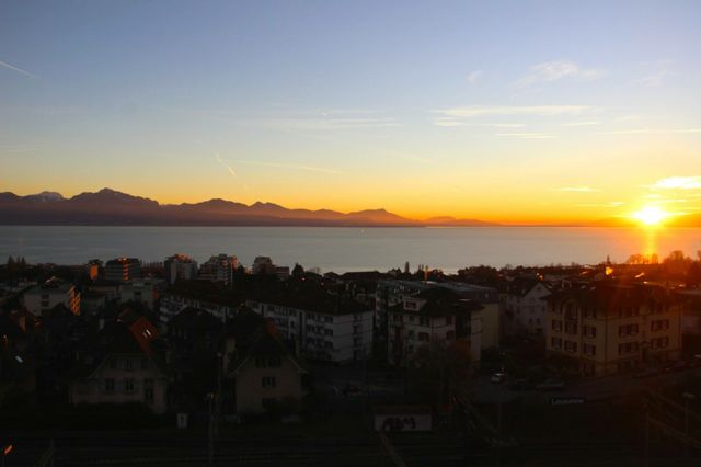 Sunset in Lausanne . Sunset of Lake Geneva overlooking Lausanne, Switzerland 