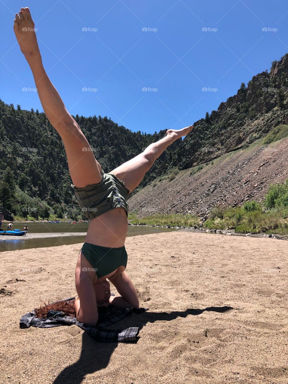 yoga before entering the rapids area of the river on the Colorado