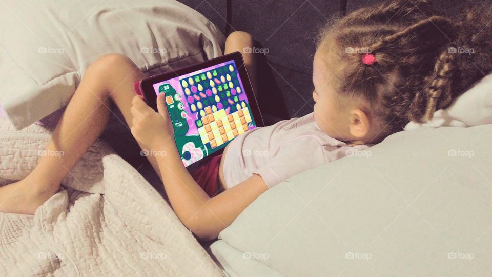 Child playing with Ipad