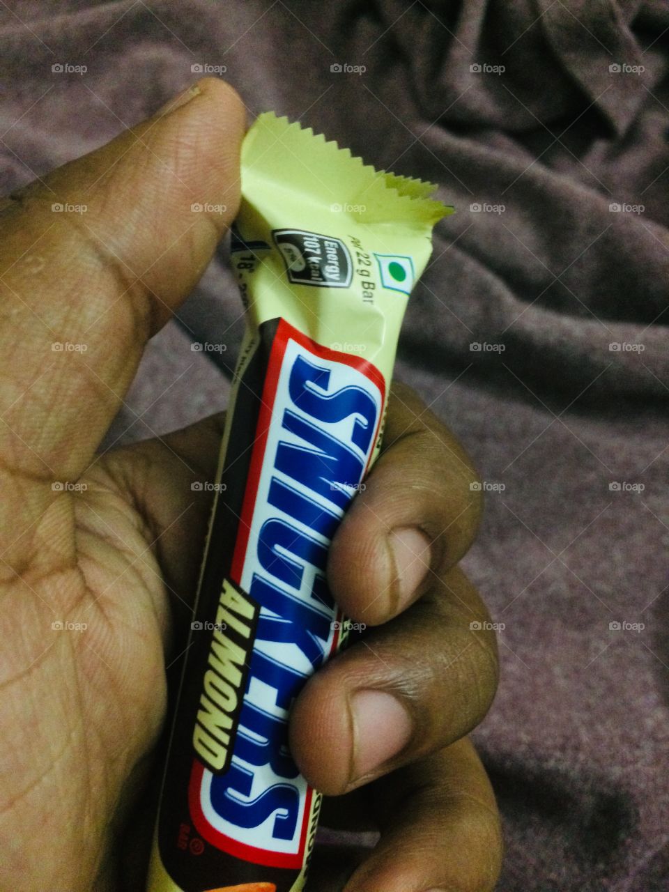 Snickers in hand