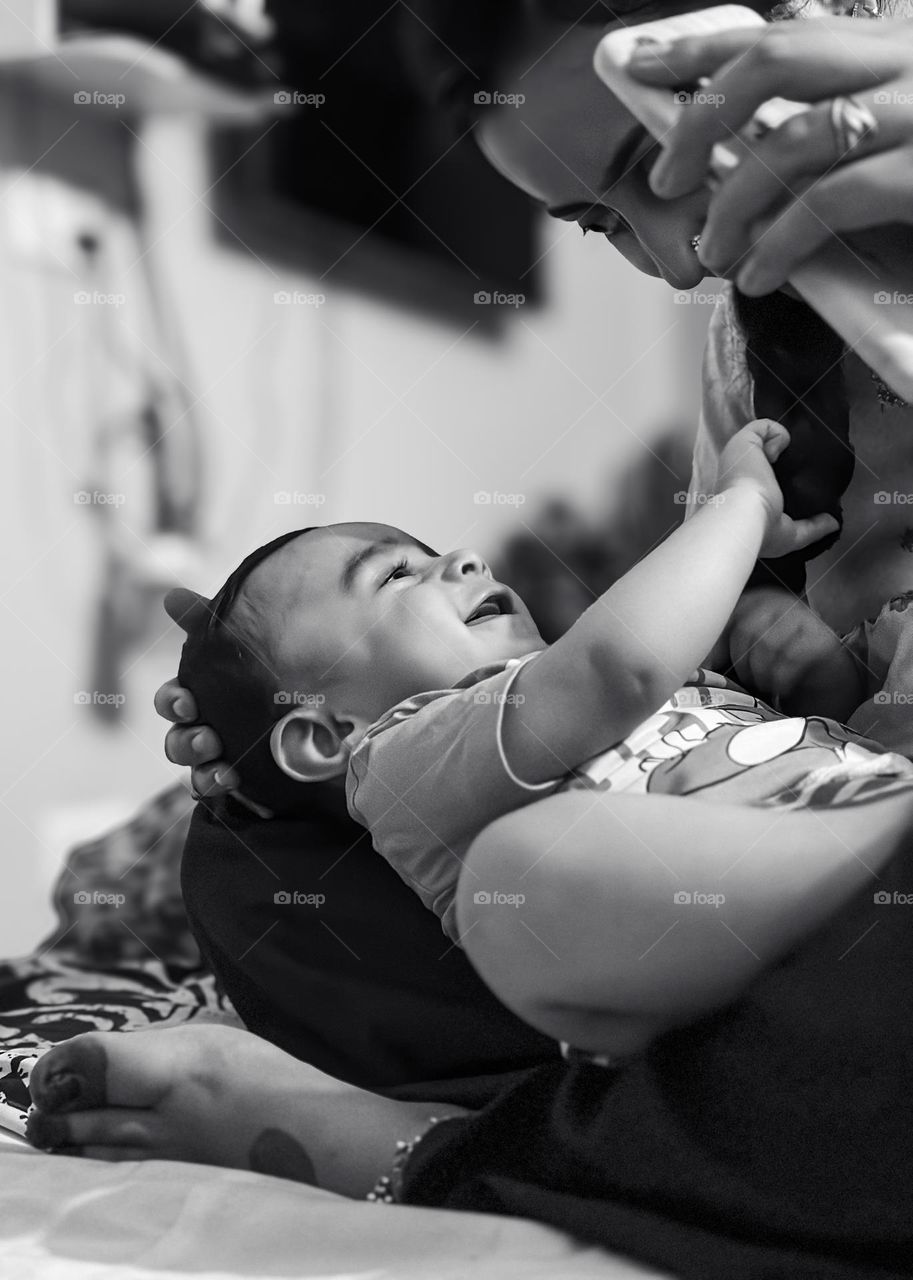 Black and white portrait of mother and child expressing emotional connection between them