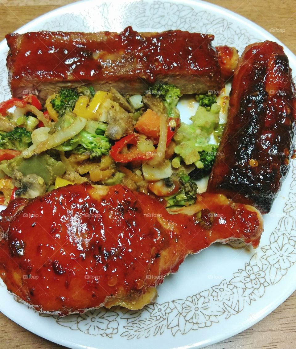 barbecue chicken barbecue ribs barbecue sausage and stir-fry vegetables