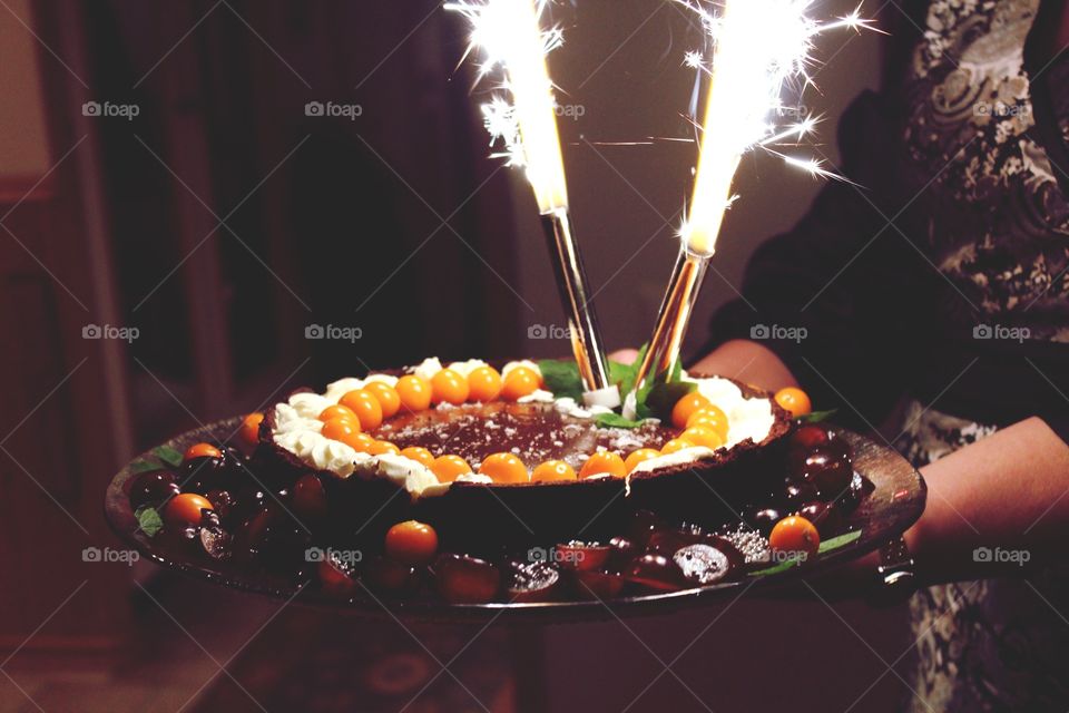 Woman carrying new years eve dessert