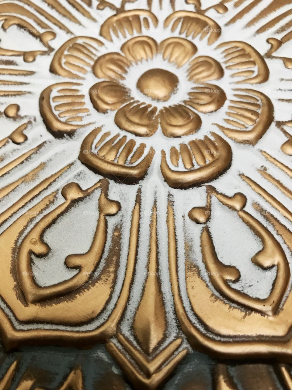 Gold flower artwork close up.