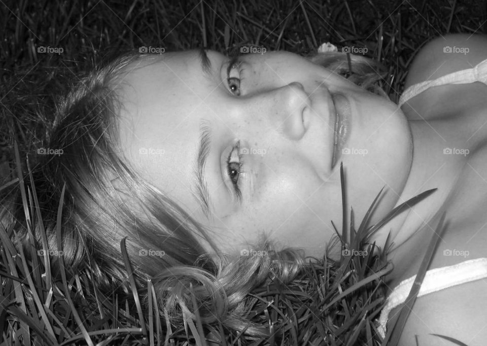 laying in the grass