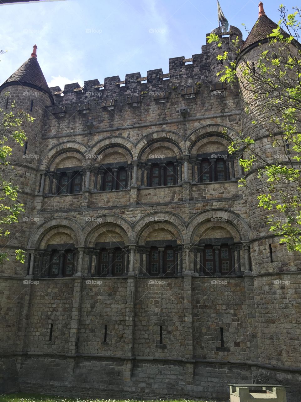 Castle wall. Old castle in Belgium highlighted by some trees 