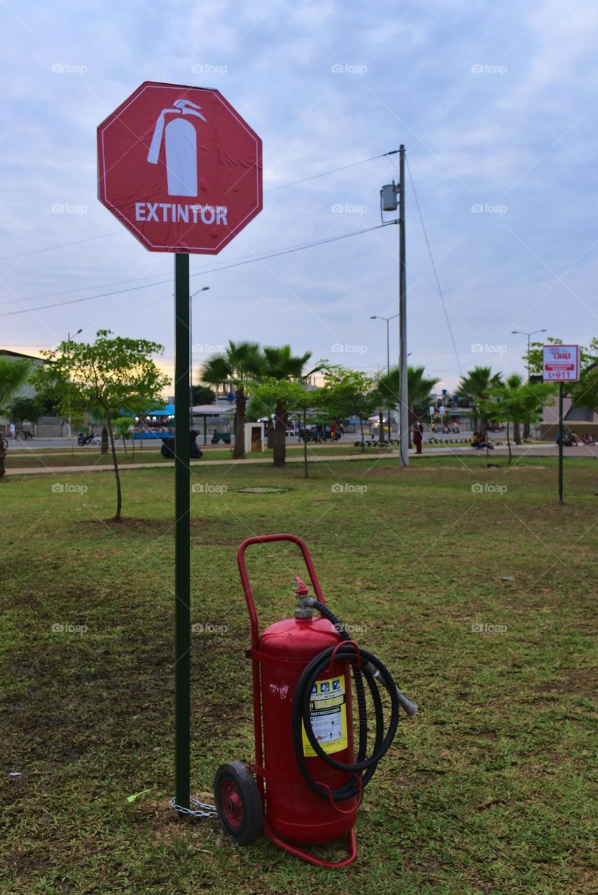 Fire extinguisher sign with red portable fire extinguisher