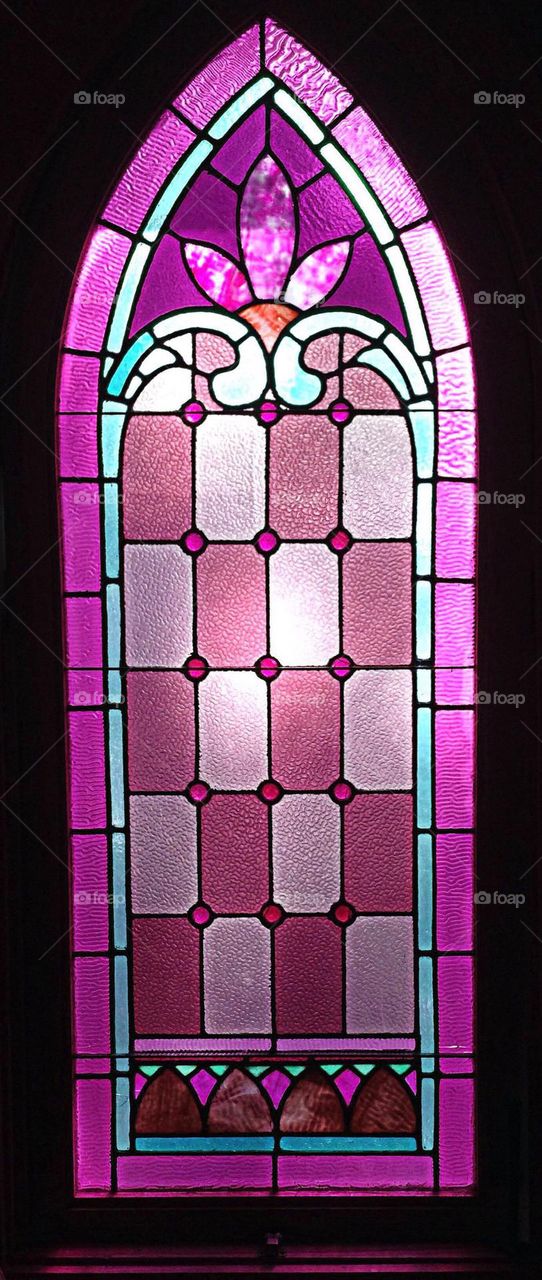 Magenta stained glass window.