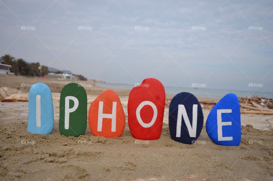 Iphone word on colourful stones
