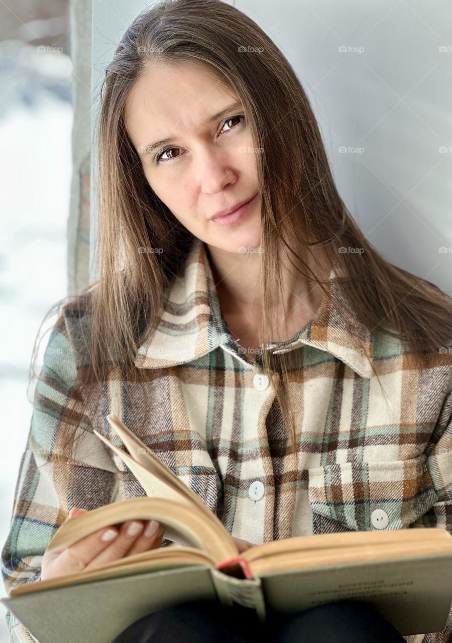 portrait of a woman at the window