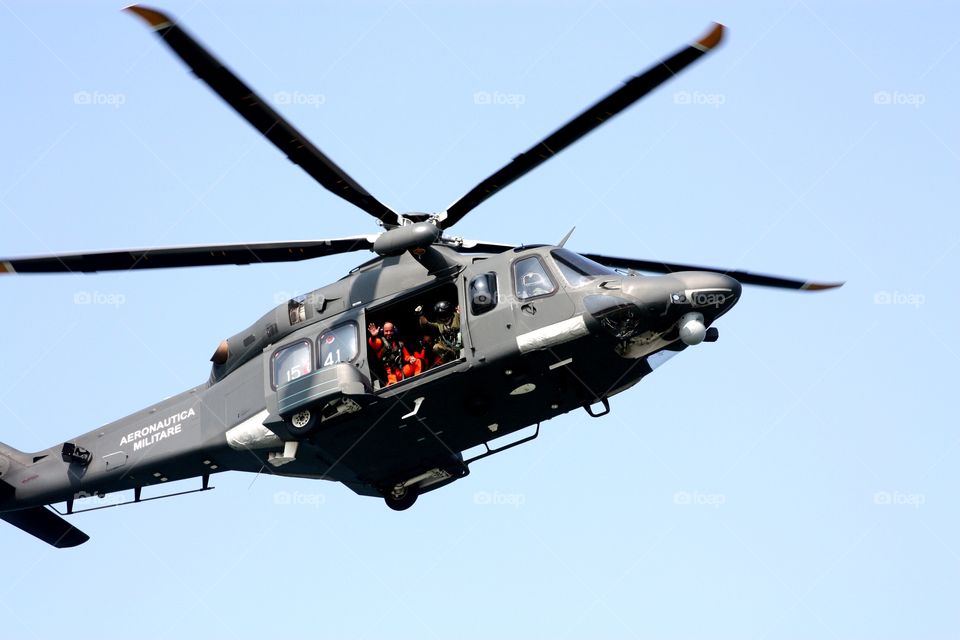 Waving at us from the helicopter