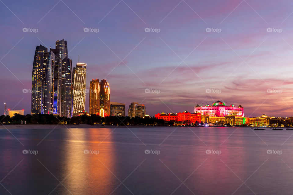 Abu Dhabi cityscape at the sunset. Urban landscape.