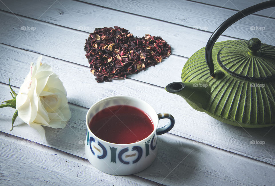 Heart symbol made of red tea leaves