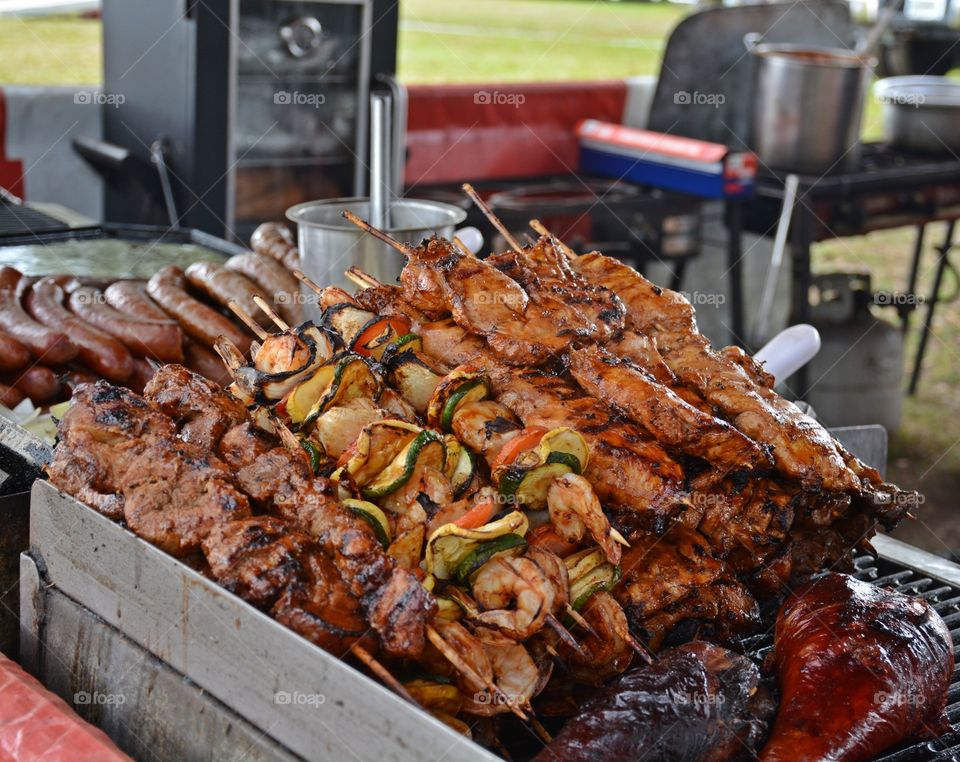 Barbecue season has begun. Here we have moist and flavorful grilled beef, pork skewers and shrimp kabob along with turkey drumsticks and sausage. Get your plate and dig in