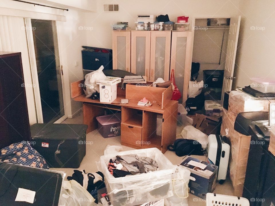 Messy room that hasn't been unpacked after moving
