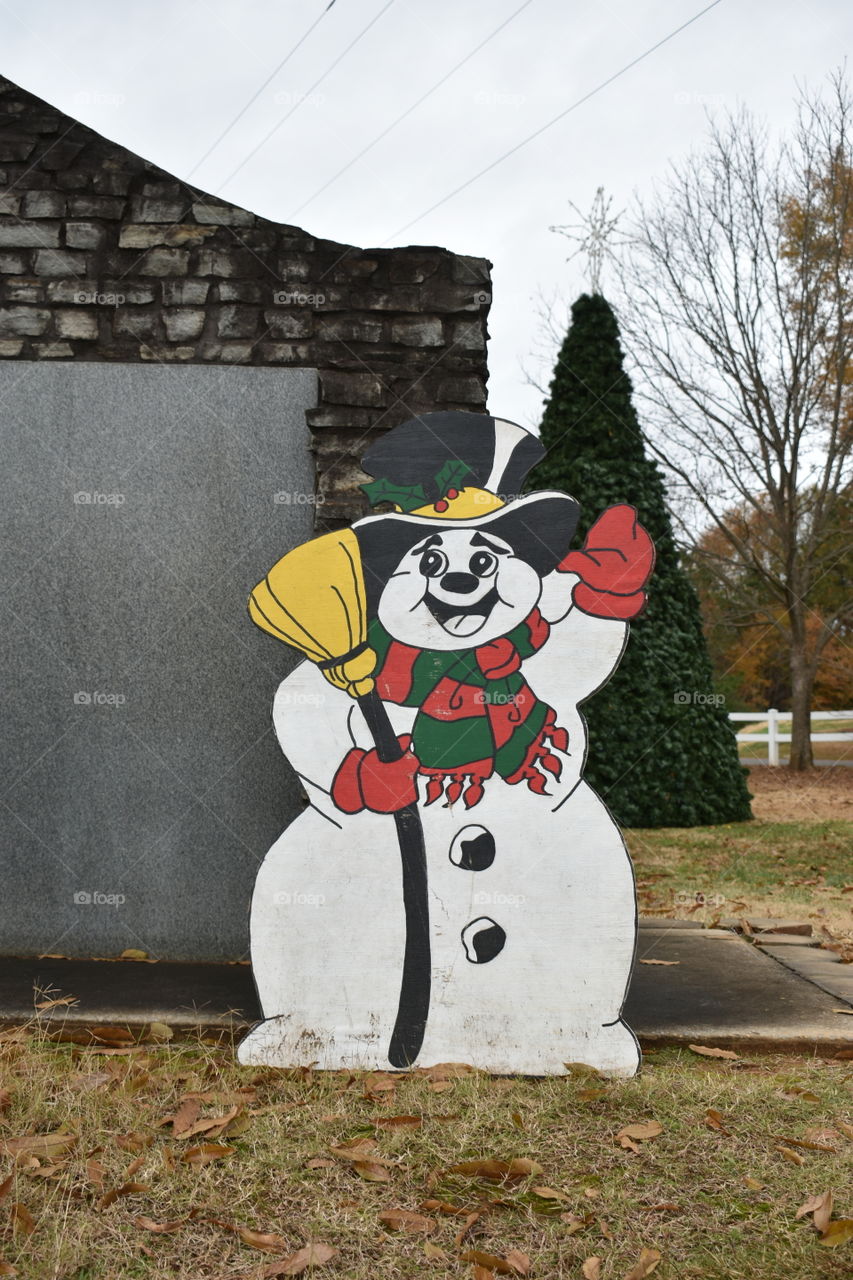 frosty the snowman and a Christmas tree.