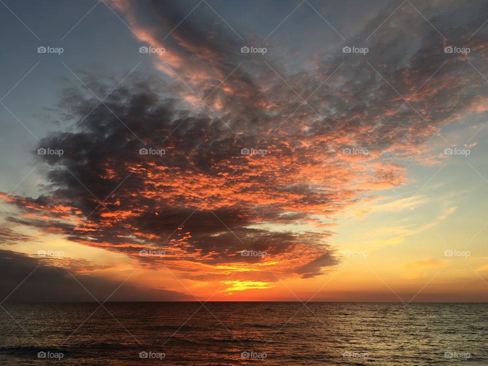 Scenic view of stormy sunset