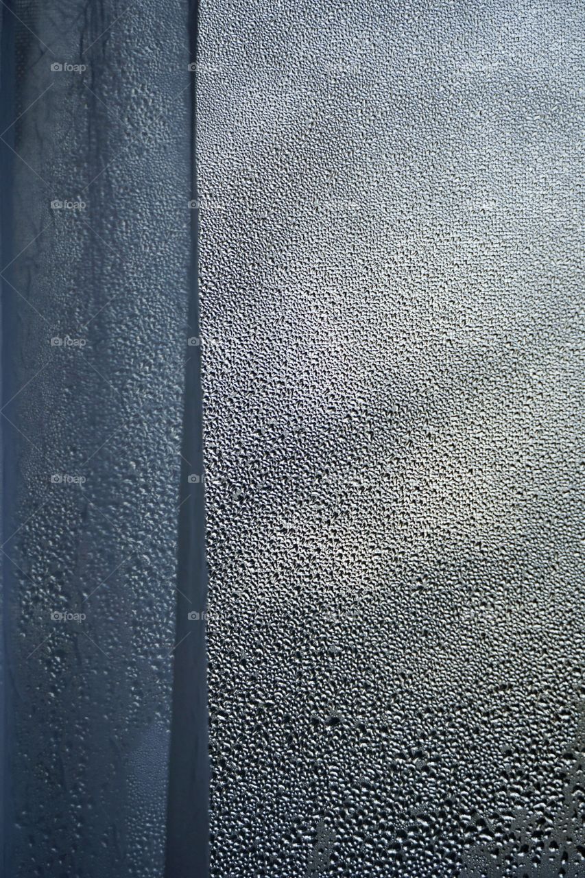 Frosted windowpane, a telltale sign of winter. 