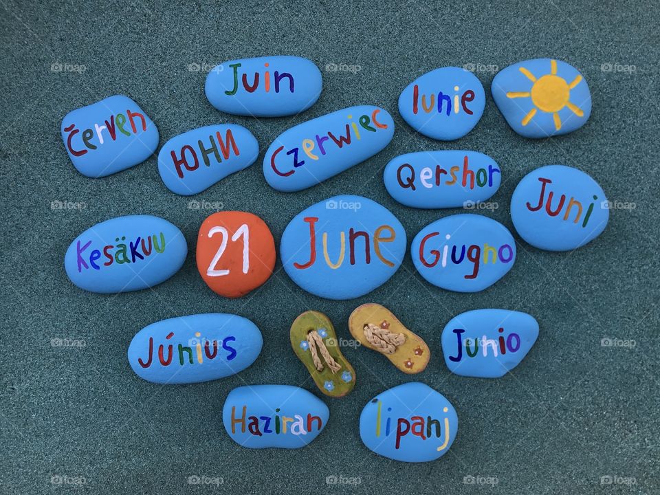 21 June in many languages on pained stones