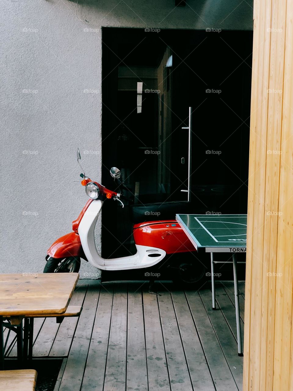 Lonely stylish scooter on the street near grey wall, nobody 