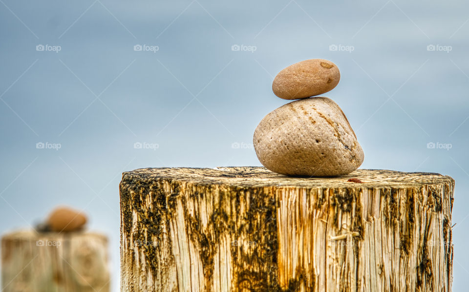 Stones stacked on a pole