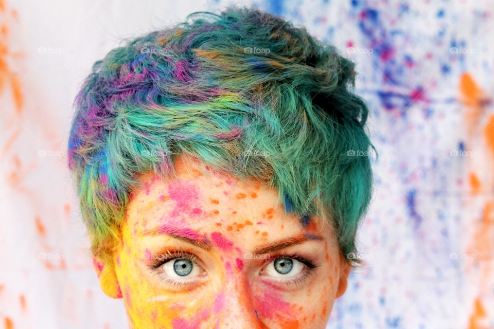 Close-up of a woman with colorful face