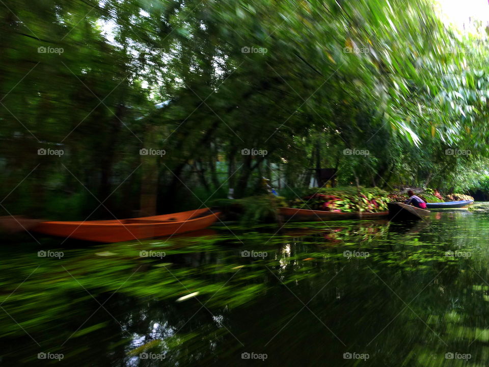 fisherman and boats caught in motion