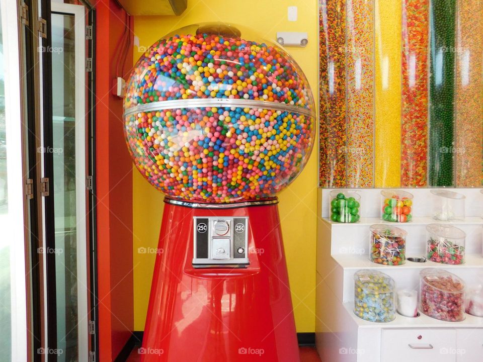 red candy machine with sweets and coin spot